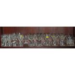 An assortment of glassware, including Stuart crystal hocks, etched brandy balloons, liqueur glasses,