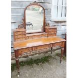 A Victorian burr maple dressing table, fitted central mirror, six jewel drawers over three drawers