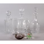 Three cut glass decanters, a cocktail mixer jug and other glass