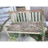 A teak slatted garden bench, 47 1/2" wide