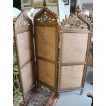 A 19th century Venetian Gothic carved giltwood three-fold screen with fabric panels, panel 63" x 18"