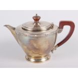 A silver teapot with fruitwood handle and knop, 16oz troy approx