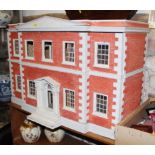 A doll's house of Georgian design, 36" wide x 24" high, a collection of doll's house furniture and
