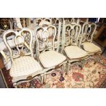 A set of ten 19th century Italian carved giltwood and painted side chairs with shaped cane seats, on