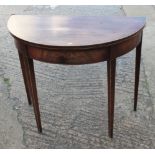 A George III mahogany semicircular fold-over top card table, on square taper supports, 36" dia x 30"