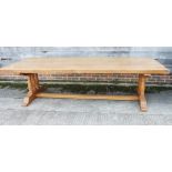 An oak refectory dining table with planked top, on chamfered supports, 114" long x 48" wide x 29"
