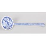 A 19th century blue and white ladle, decorated house in a landscape, 13" long overall