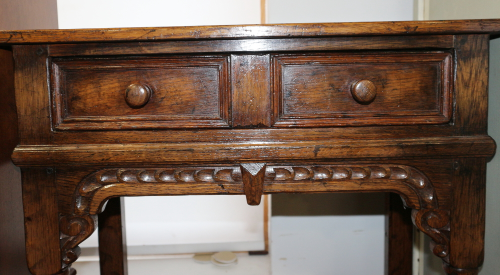 A carved oak side table of 17th century design, fitted one drawer, on turned and stretchered - Image 2 of 2