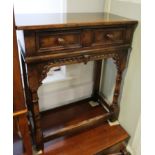A carved oak side table of 17th century design, fitted one drawer, on turned and stretchered