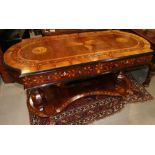 An early 19th century Italian walnut and yew marquetry work shape top centre table, fitted two
