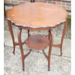 An Edwardian shape top two-tier occasional table, on cabriole supports, 28" dia x 27" high