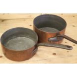 Two 19th century copper saucepans with wrought iron handles, 10" dia