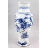 A 19th century Chinese blue and white baluster vase, decorated warriors on horseback, 19 1/2" high