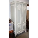 A French duck egg blue and white painted wardrobe with carved panel doors, on cabriole supports,