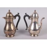 An Elkington & Co silver coffee pot with ebonised handle and a matching hot water pot, 25.3oz troy