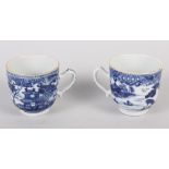 Two Chinese blue and white coffee cups, decorated buildings in a landscape (hairline crack to one)