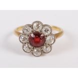 A Victorian yellow metal, diamond and red stone cluster ring, size J, 2.9g