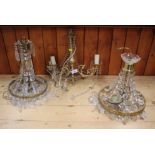 A gilt metal and crystal drop chandelier and two others