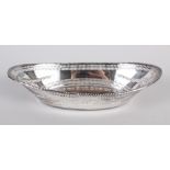 A silver oval dish with pierced and swag decoration, 7.7oz troy approx