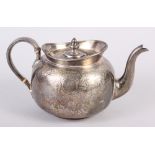 A Victorian silver teapot with engraved decoration, 19.7oz troy approx