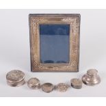 A silver photograph frame, five silver pill boxes, various, a silver capstan inkwell and four silver