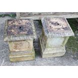 A pair of square sandstone stands, 19" high x 12 1/2" square