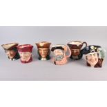 A collection of twelve Royal Doulton character jugs, including Lord Nelson, Beefeater, Aramis,