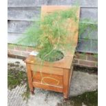 A pine commode, on turned supports, 17" wide, and a fern (planted in commode)