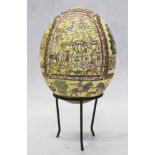An ostrich egg with "mosaic" decoration in early Byzantine style, on metal stand