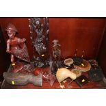 Three Oriental carved hardwood figures and a number of carved wood vase and plate stands, etc