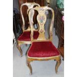 A pair of 19th century gilt and painted vase splat back side chairs with red velvet drop-in seats,