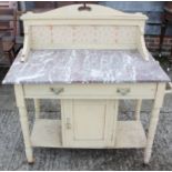 A marble top and tile back wash stand, fitted drawers and cupboard, on turned supports, 36" wide x