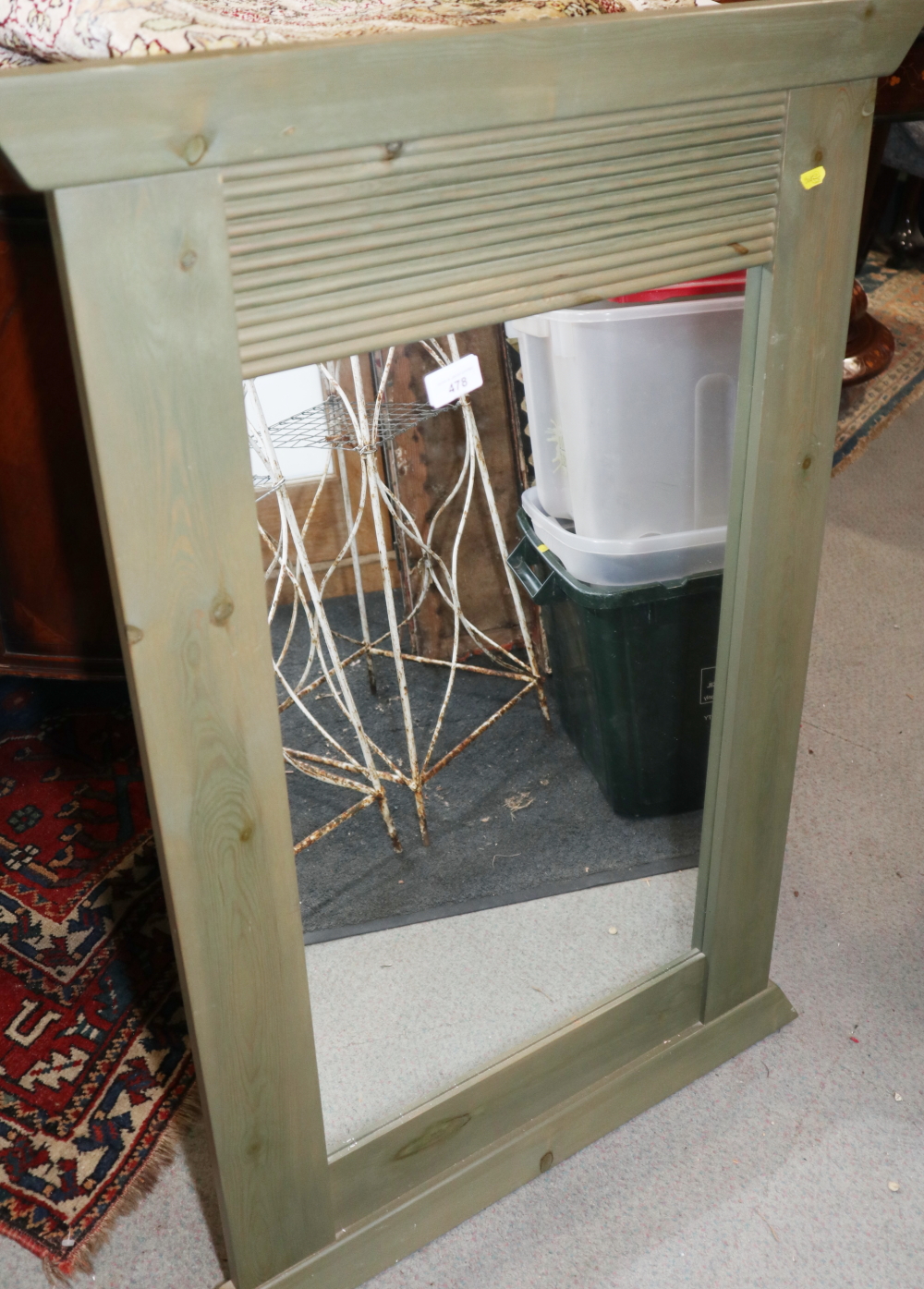 A green stained pine wall mirror, 26 1/2" x 16 1/2"