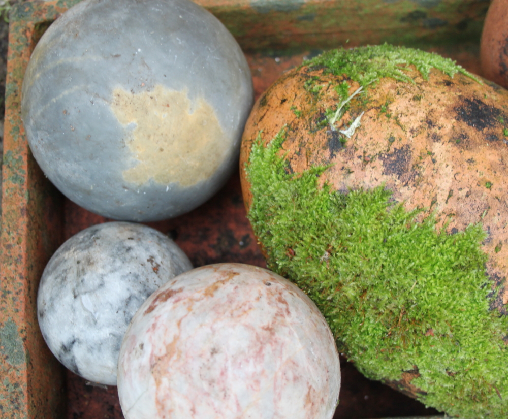 Four hardstone balls, a hardstone finial, two terracotta egg-shaped ornaments, a white glazed - Image 2 of 3