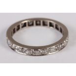 A white metal and diamond set full eternity ring