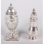 A silver pepper pot with swag decoration, on square base, and another pepper pot with engraved