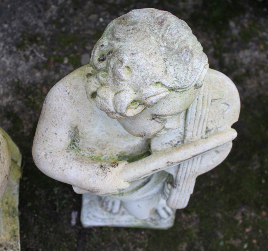 A sandstone figure of a boy playing a horn, 28" high, and a similar figure of a boy playing a violin - Image 3 of 4