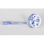 A 19th century blue and white ladle, decorated birds and flowers, 7" long