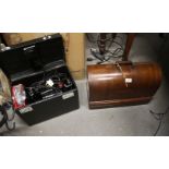 An early 20th century Singer sewing machine, in mahogany dome top case, and an electric Singer