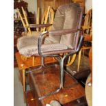 A set of four Pieff chrome conference chairs with brown faux leather backs and arms and chequered