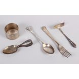 A child's silver spoon and pusher, a silver napkin ring, a silver fork and a silver spoon, 3.3oz