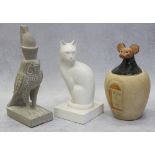 An Egyptian canopic jar and cover, 7 1/2" high, a figure of Horus Ra, 9" high and a cat, 8" high