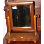 A 19th century walnut swing frame toilet mirror, on plateau base, 13" wide x 5 1/2" deep x 15 1/2"