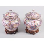 A pair of cloisonne jars and covers, on hardwood stands, 12" high overall