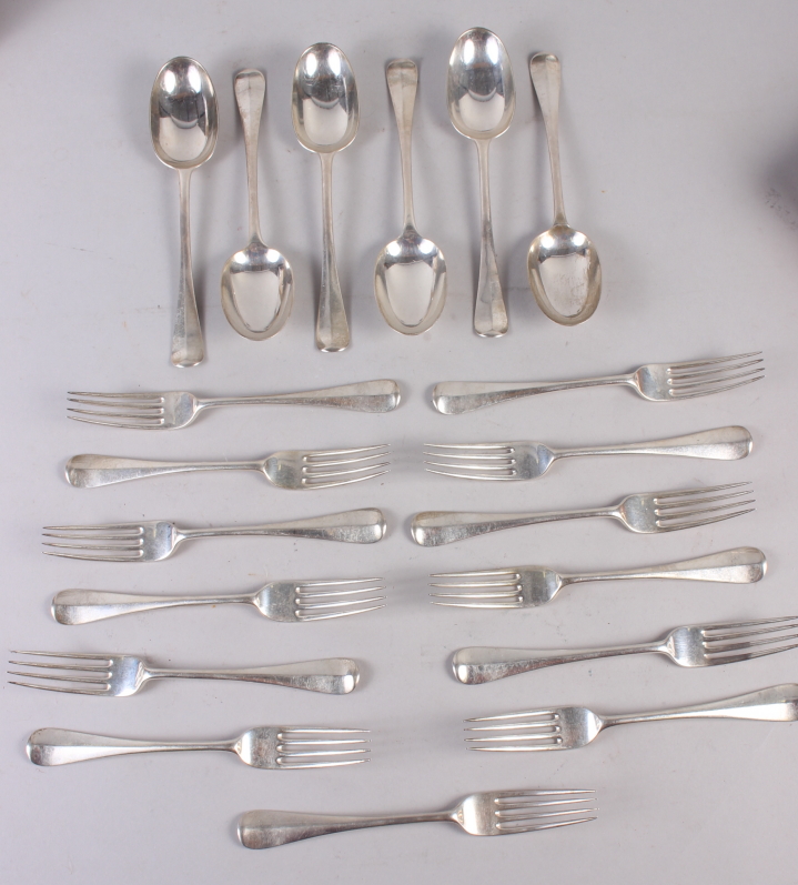 A set of thirteen Hanoverian pattern table forks, engraved demi-lion crest and six matching rat-tail