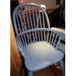 A blue painted spindle back low armchair, on turned supports