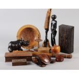 A turned burr elm bowl, two treen hatpin stands, two ebony figures and other treen