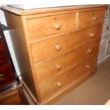 A pine chest of two short and three long graduated drawers, 41 1/2" wide, on block base