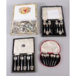 A cased set of six silver teaspoons, another set of teaspoons, a silver plated pair of sugar