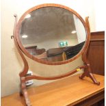 A walnut oval swing frame toilet mirror, on skeleton stand, 20" wide x 20" high